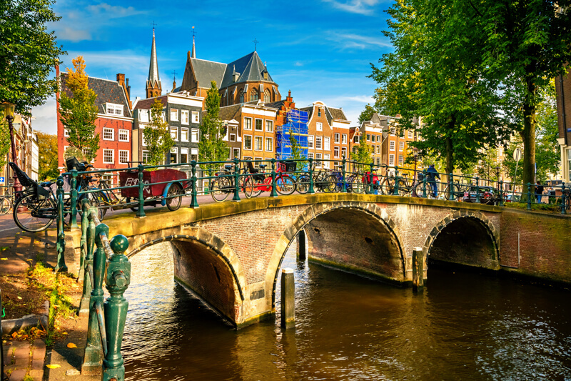 Canal-side street in Amsterdam during a live tour